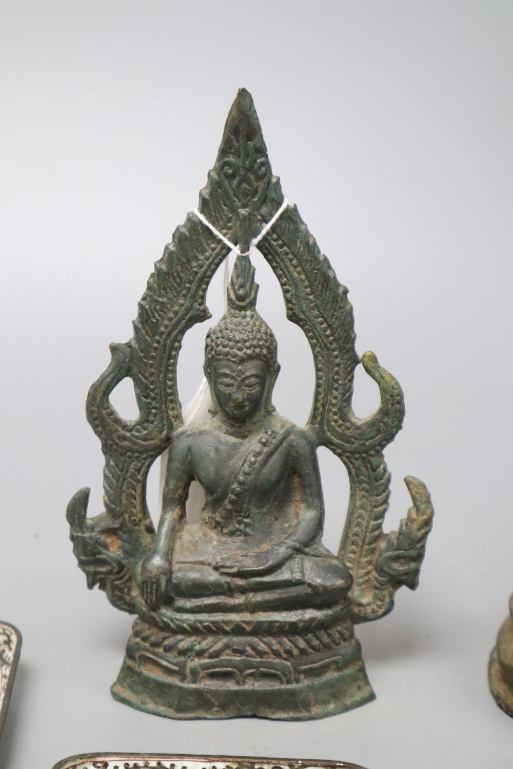 A 19th century bronze Thai standing figure, a Thai bronze seated figure and four Canton enamel dishes